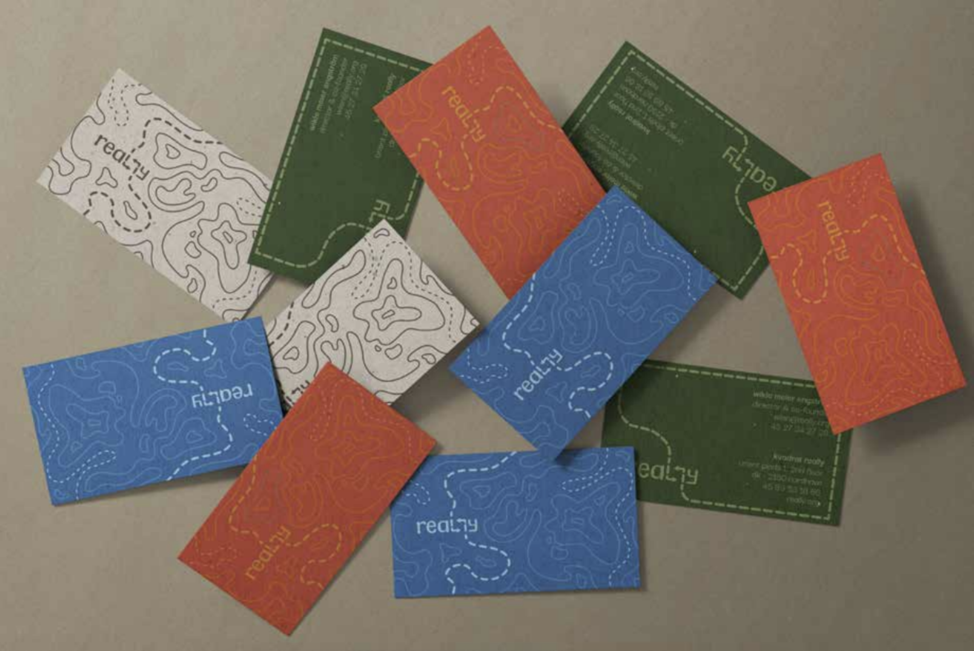 Various business cards designed for the company Really, depicting topographical contours.