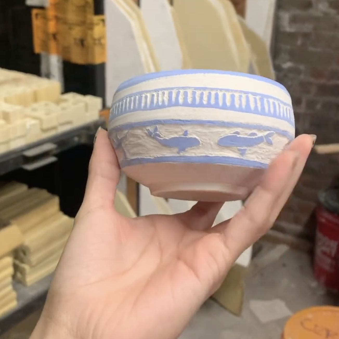 A small ceramic bowl created by Connie with sea creatures on it.