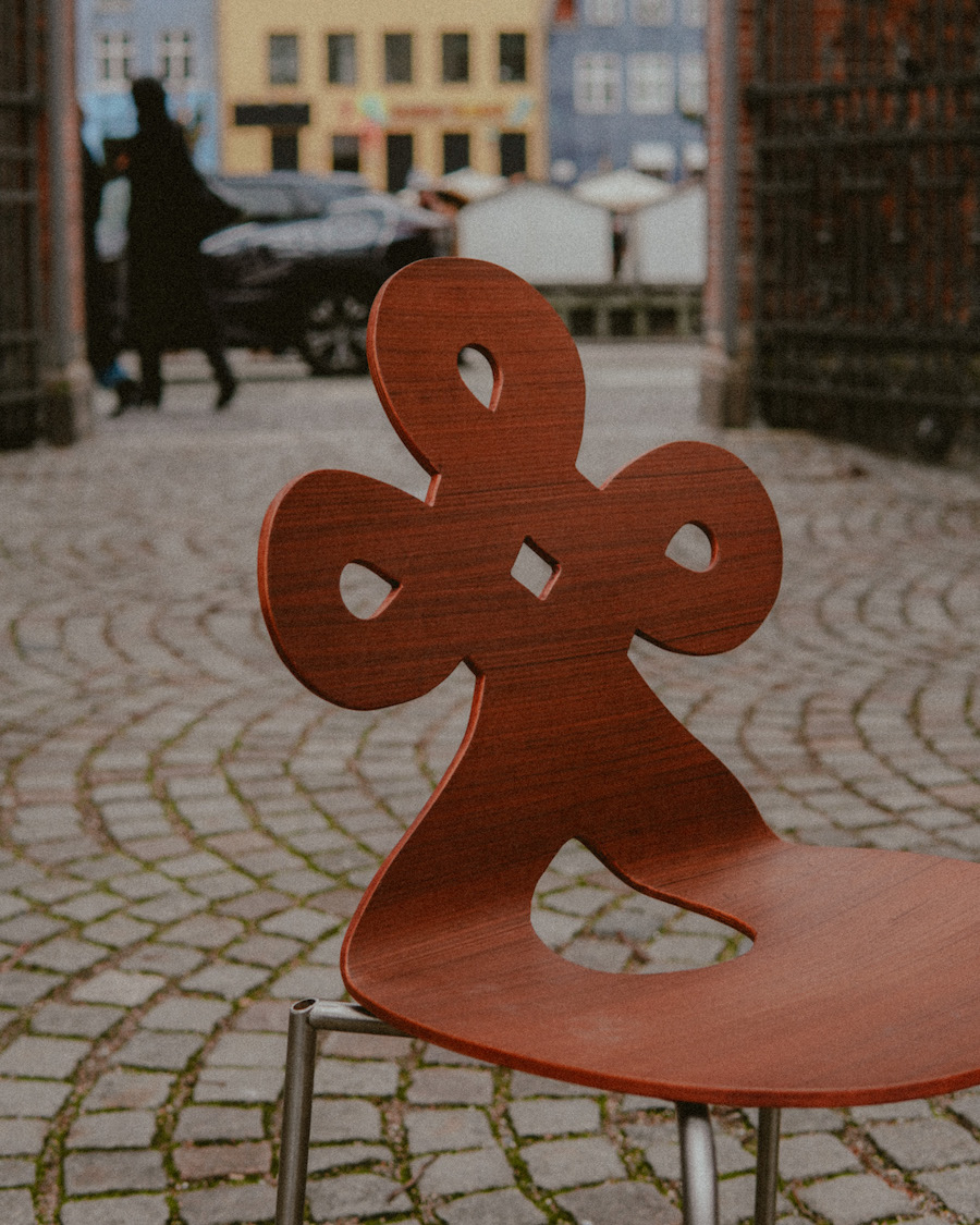 A close-up shot of a wooden chair Connie made that was inspired by Chinese ornamentation.